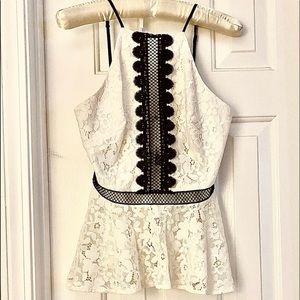 Bebe white eyelet lace top, black trim, spaghetti straps, and zipper.